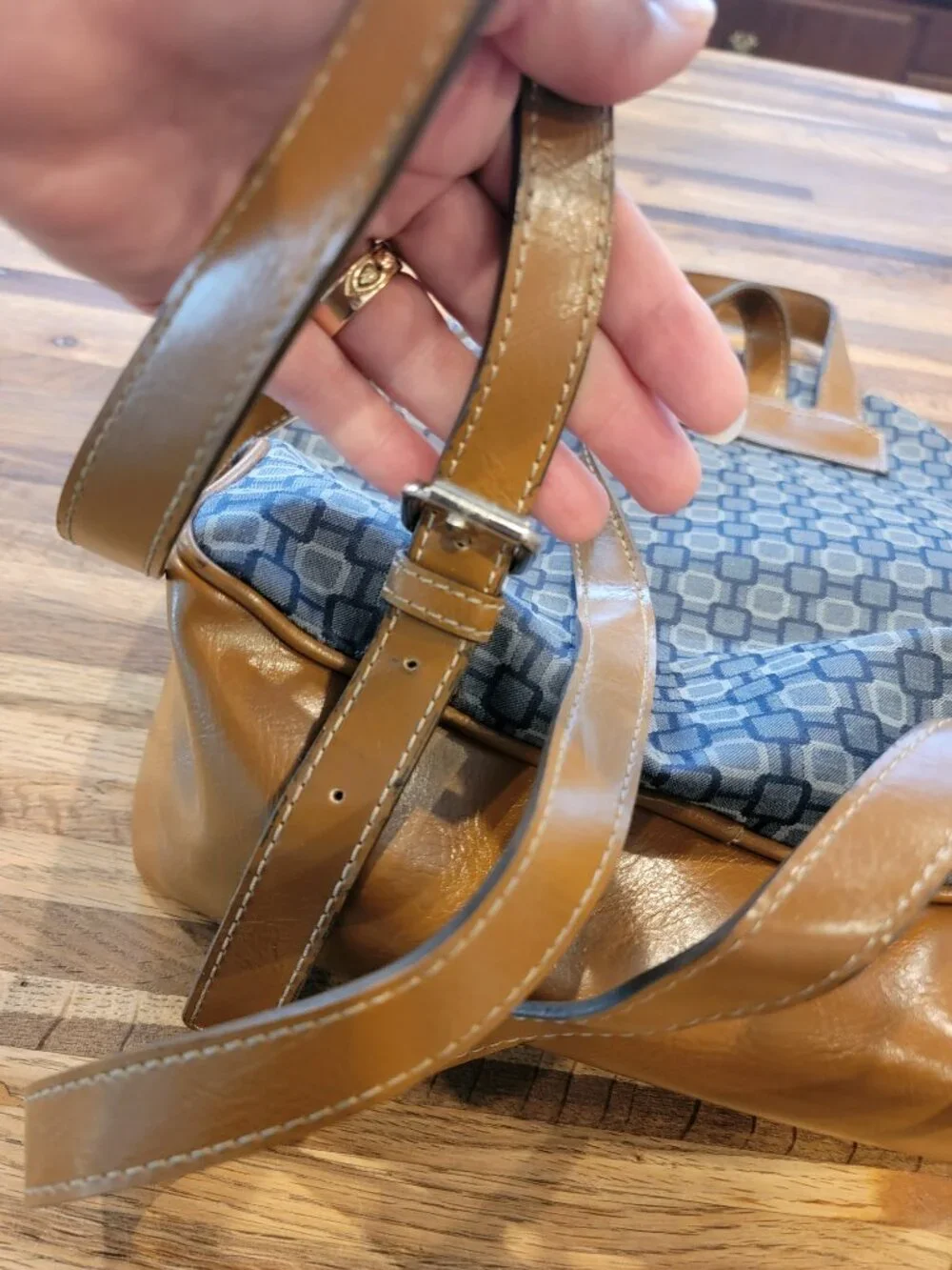 Nine West backpack purse featuring a geometric pattern and brown faux leather tr